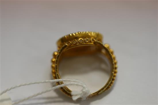 A 19th century two colour gold and oval cameo set ring, size F.